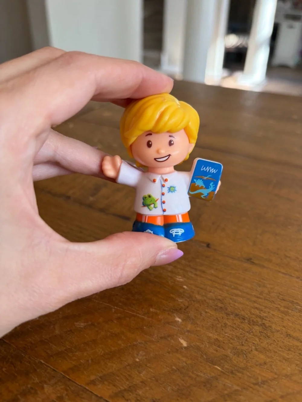 Fisher Price Little People Eddie with dinosaur book as is